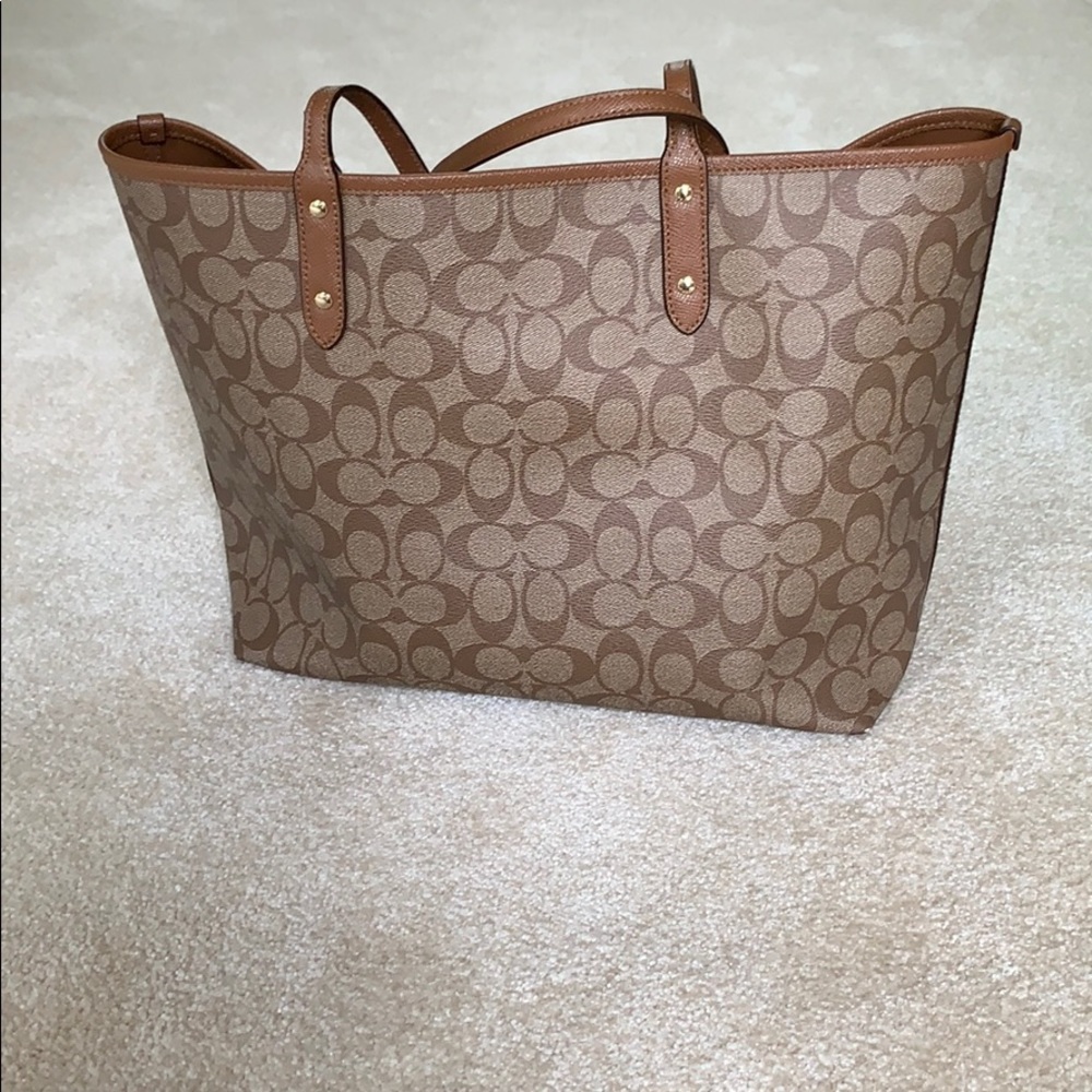 Coach large reversible tote with insert pouch.